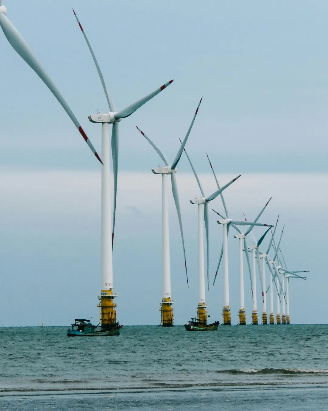 Wind turbines and solar panels — the kind of project this funds